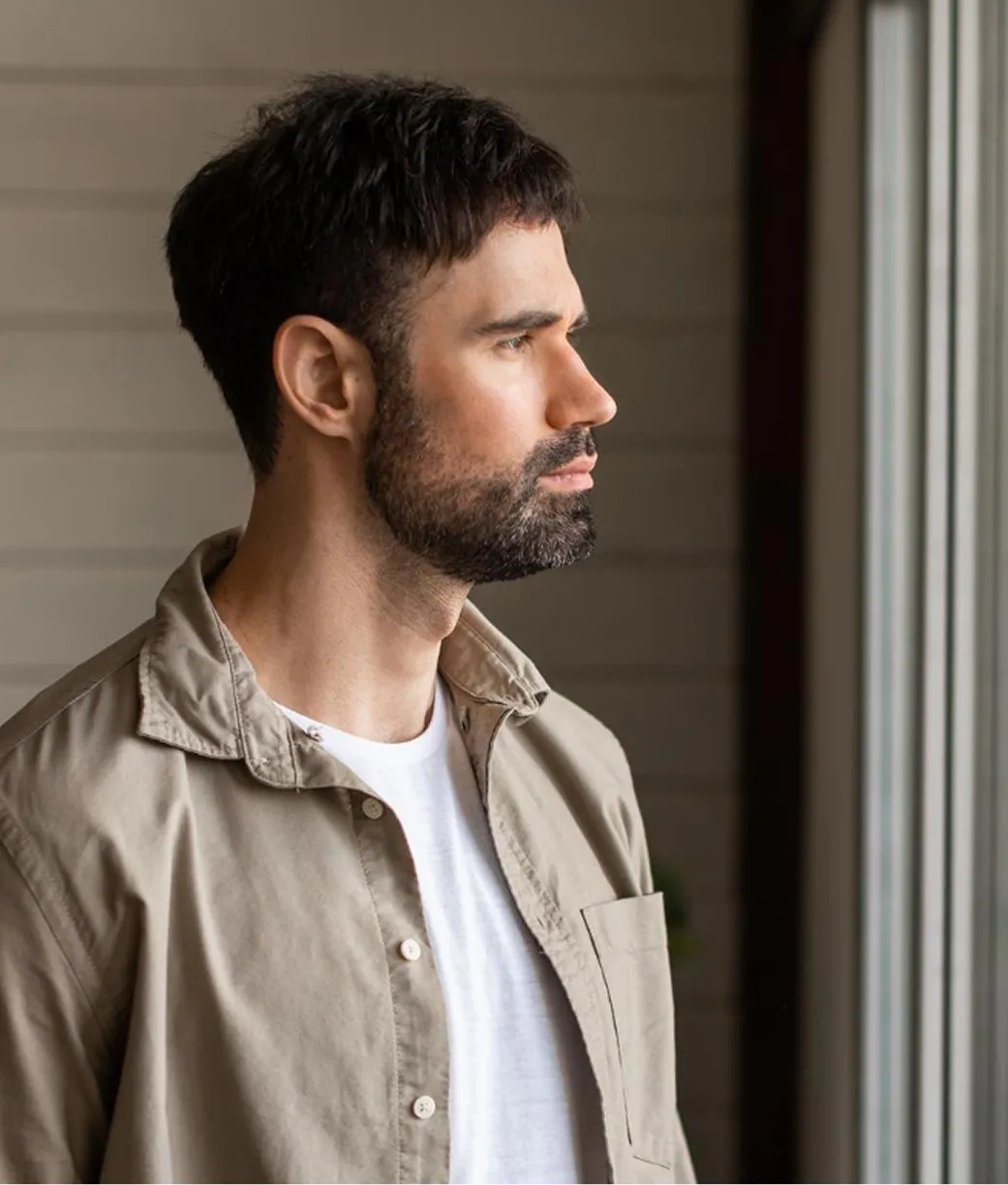 Men in reflection by the window